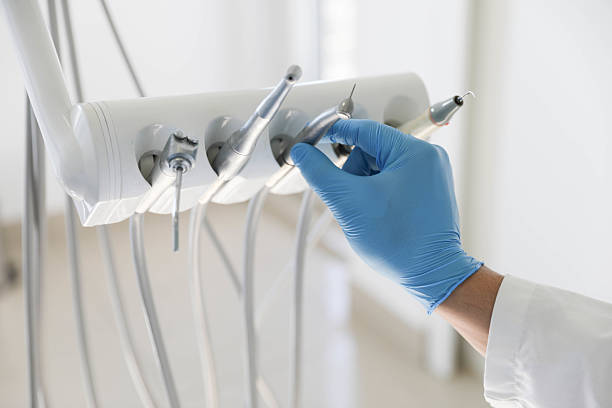 Professional Root Canal Treatment technician working in East Franklin, NJ